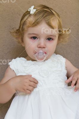 Cute infant with tear