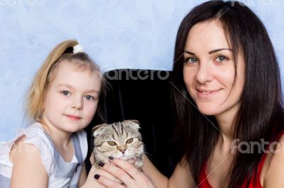 Mother, daughter and grey kitty