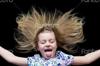 Girl imitate witch and put out tongue Girl imitate witch and put out tongue