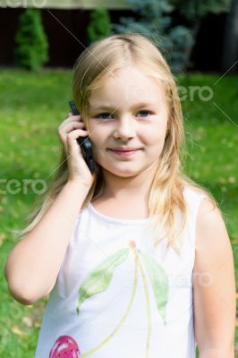 Cute girl talking by cellular