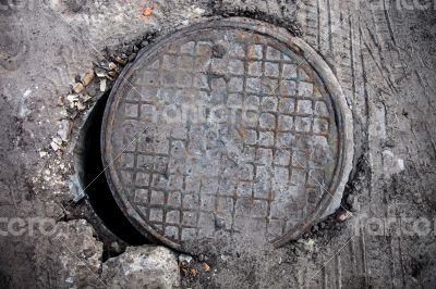 Open manhole with metal cover
