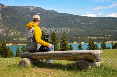 Man and chihuahua on a bench