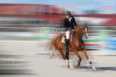 Pretty young girl walking on a horse competition at the riding.