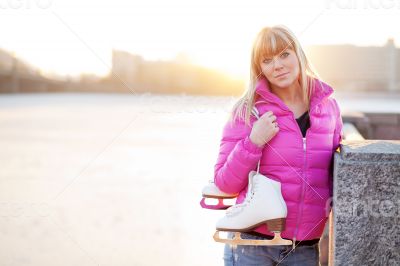 Figure skater woman in city riverfront