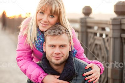 Woman is hugging her boyfriend in winter