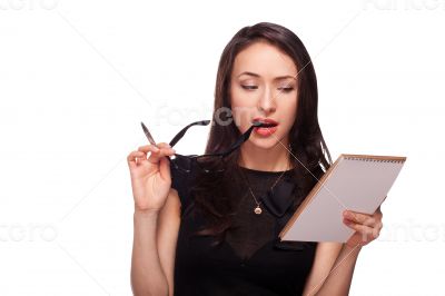 Sexy woman in glasses with notepad