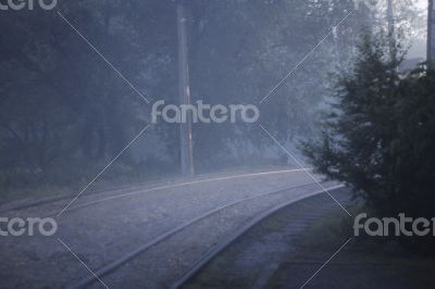 A Twisted railroad in the foggy evening