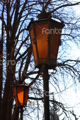 Retro street lamp shining at the twilight Retro street lamp shining at the twilight