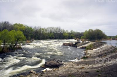 Threshold of the mountain river and wet stones