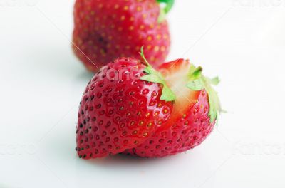 Healthy red strawberry fruit sliced isolated on the white backgr