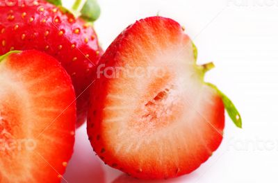 Healthy red strawberry fruit sliced isolated on the white backgr