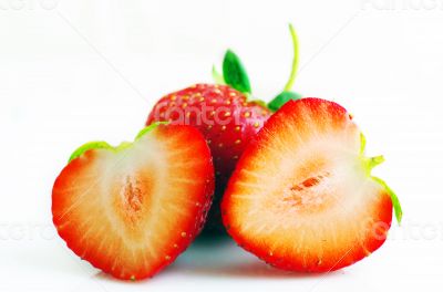 Healthy red strawberry fruit sliced isolated on the white backgr