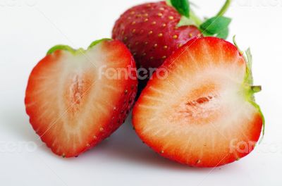 Healthy red strawberry fruit sliced isolated on the white backgr