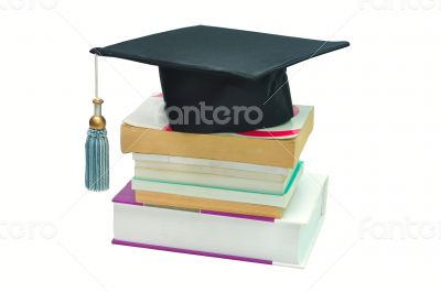 Graduation cap on top of a stack of books