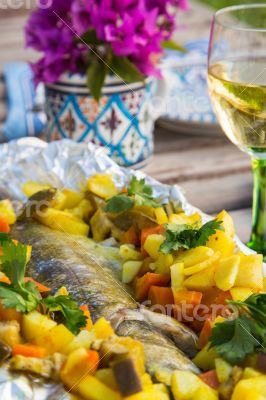 Baked sea bass with vegetables and curcuma