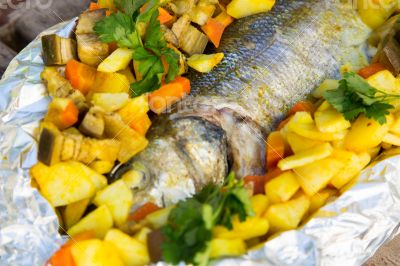 Baked sea bass with vegetables and curcuma