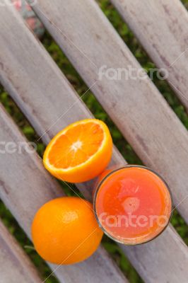 Oranges and a glass of fresh orange juice