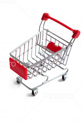 Small red shopping cart isolated