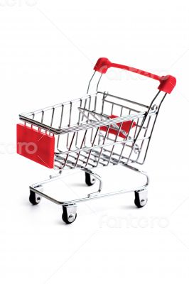 Small red shopping cart isolated