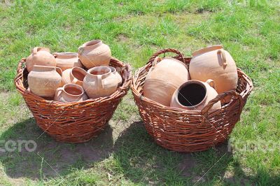 Ancient clay pots in basket