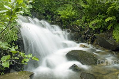landscape with waterfall in the mountains