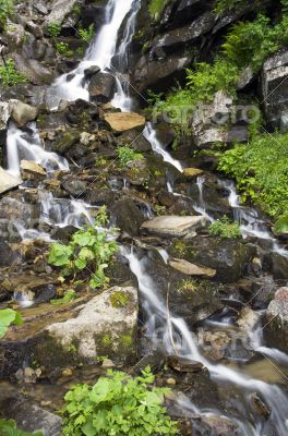 landscape with waterfall in the mountains landscape with waterfall in the mountains