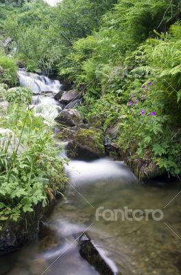 landscape with waterfall in the mountains landscape with waterfall in the mountains