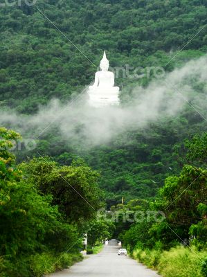 The road to white Buddha Image on the mountain