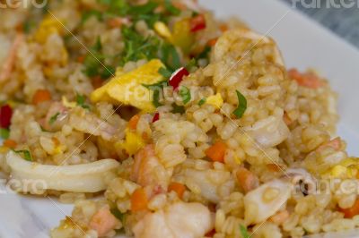 Risotto, tasty dish of boiled rice and seafood.