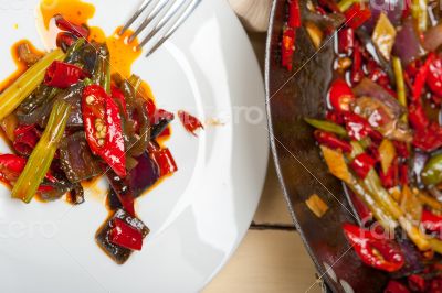 fried chili pepper and vegetable on a wok pan