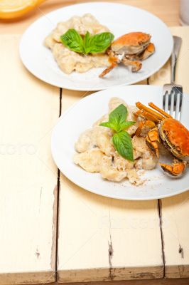 Italian gnocchi with seafood sauce with crab and basil