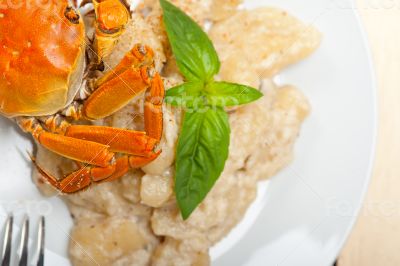 Italian gnocchi with seafood sauce with crab and basil