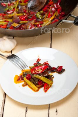 fried chili pepper and vegetable on a wok pan