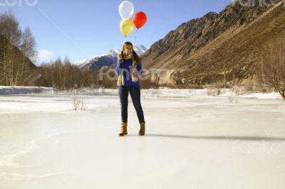 Fun girl with balloons on the hair 