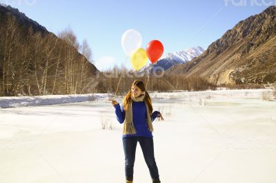 Funny girl with balloons on the hair 