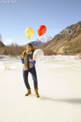 Fun girl with balloons on the hair 