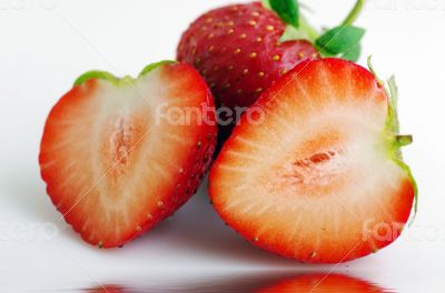 Healthy red strawberry fruit sliced isolated on the white backgr
