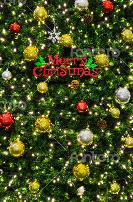 Merry Christmas sign on the tree