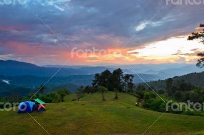 Sunset over hills at campsite on the high mountain