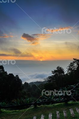 Colorful sunrise above the clouds