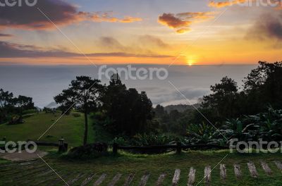 Colorful sunrise above the clouds