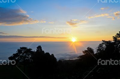 Colorful sunrise above the clouds