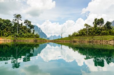 Water surface reflecting sky and cloud