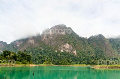 Beautiful high mountains and green lake
