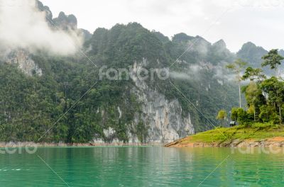 Beautiful high mountains and green lake