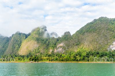 Beautiful high mountains and green lake