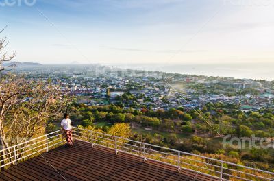 Traveler on view point Hua Hin city at sunrise