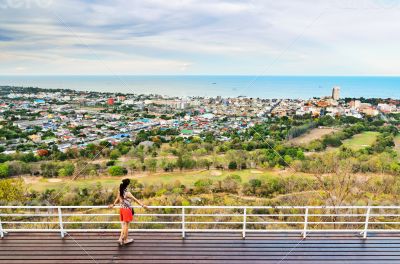 Tourists on view point Hua Hin city in the evening