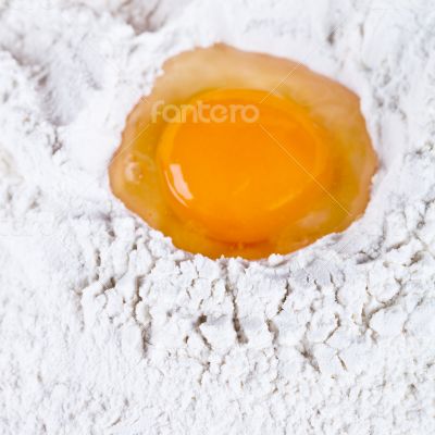 broken egg on flour