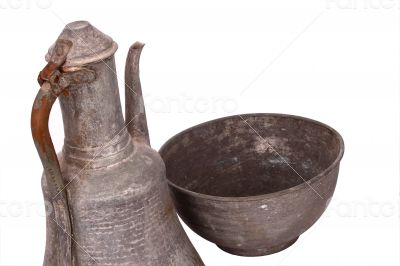 Antique copper jug on the white background